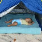Peyton (6 months) snoozing on the beach in our Child's Beach Cabana.
